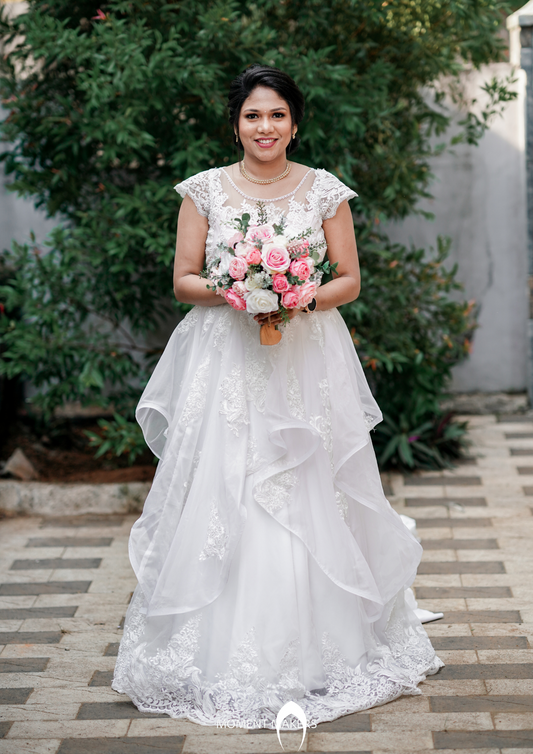 Signature Christian bridal  ruffled  gown carried by bride Jacqueline