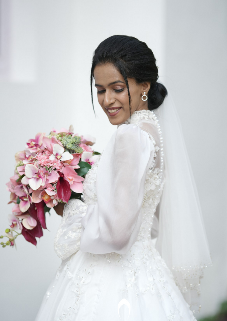 Signature Christian bridal A-line statement gown carried by bride Maria