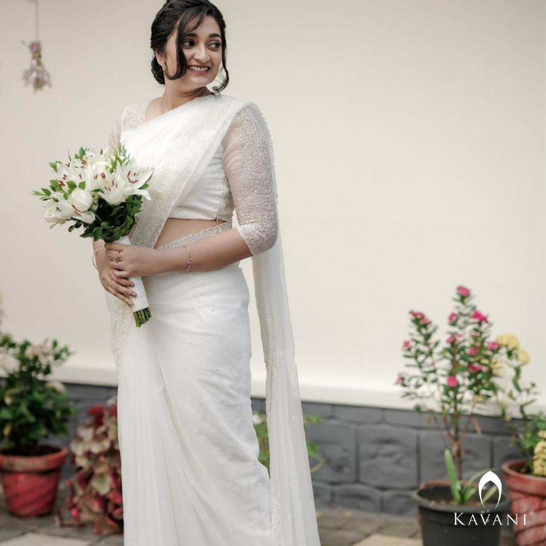 Our beautiful bride in her off white saree with beautiful hand embroidery