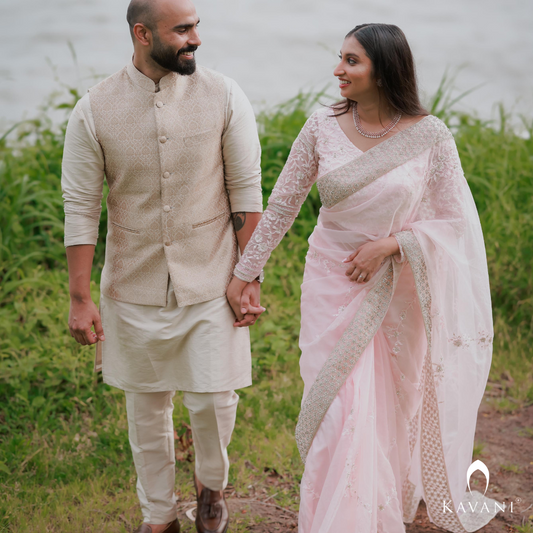 Our bride in her stunning look with a bridal saree in a pinkish shade with enhancing lace embroidery with embellishment done with hand embroidery