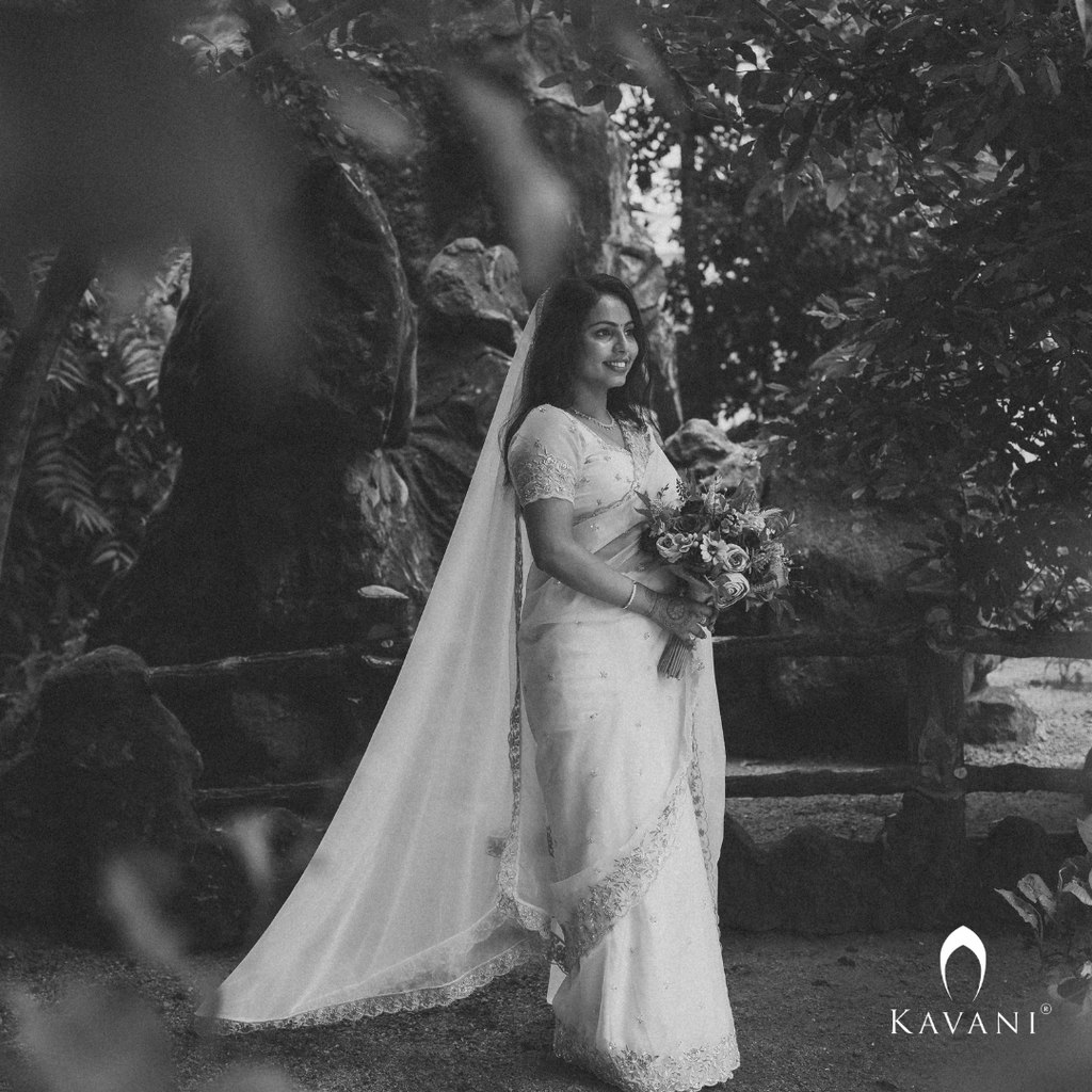 Our bride in her beautiful and stunning looking outlook wearing her bridal organza saree with machine embroidery and hand embroidery