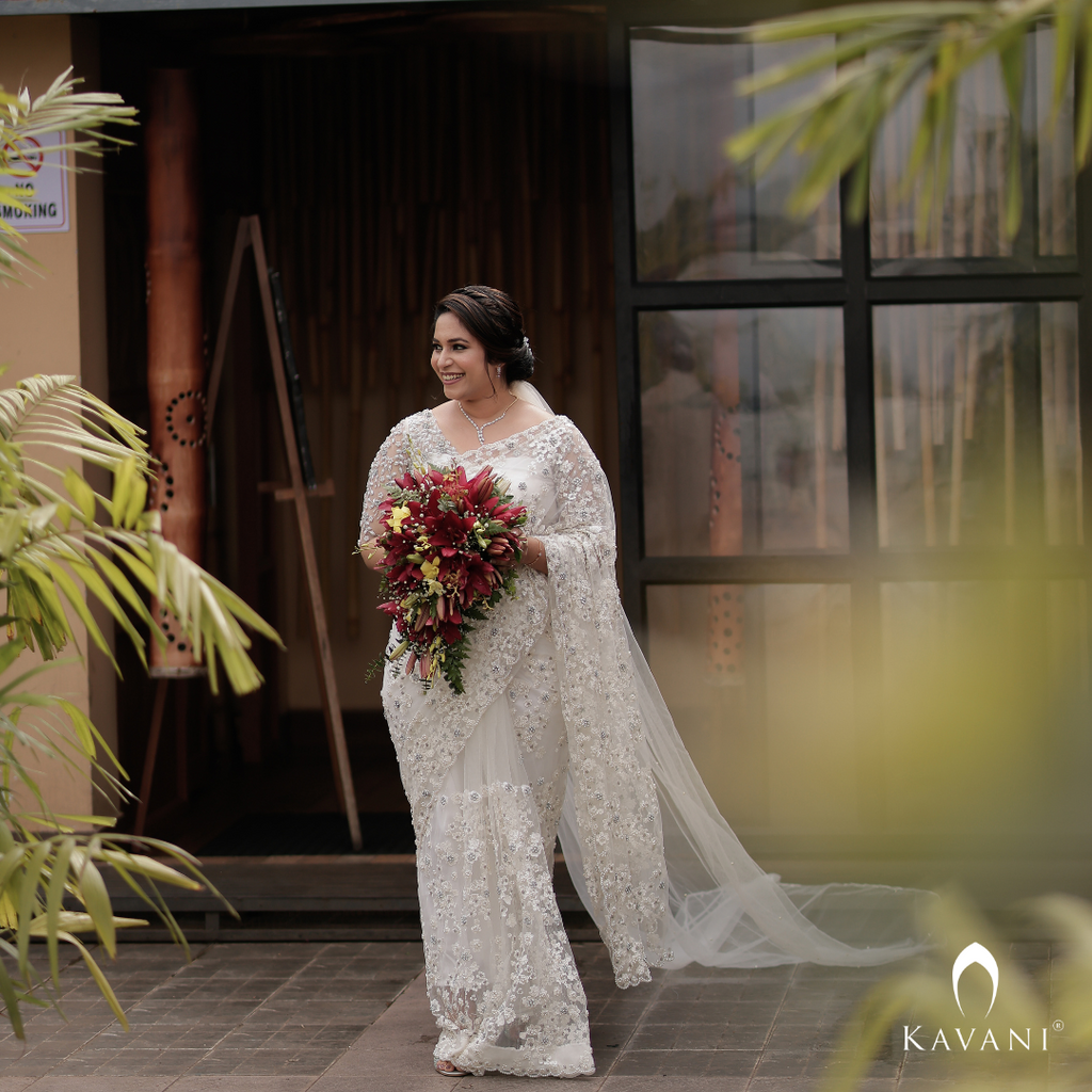 Our pretty bride in her stunning bridal saree with fully hand embroidered