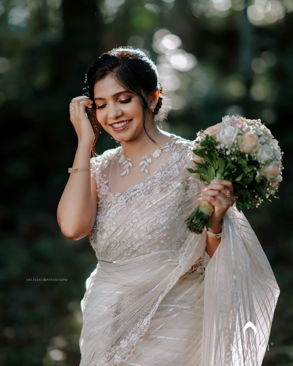 Cream organza lakhnavi embroidered saree paired with unstitched blouse
