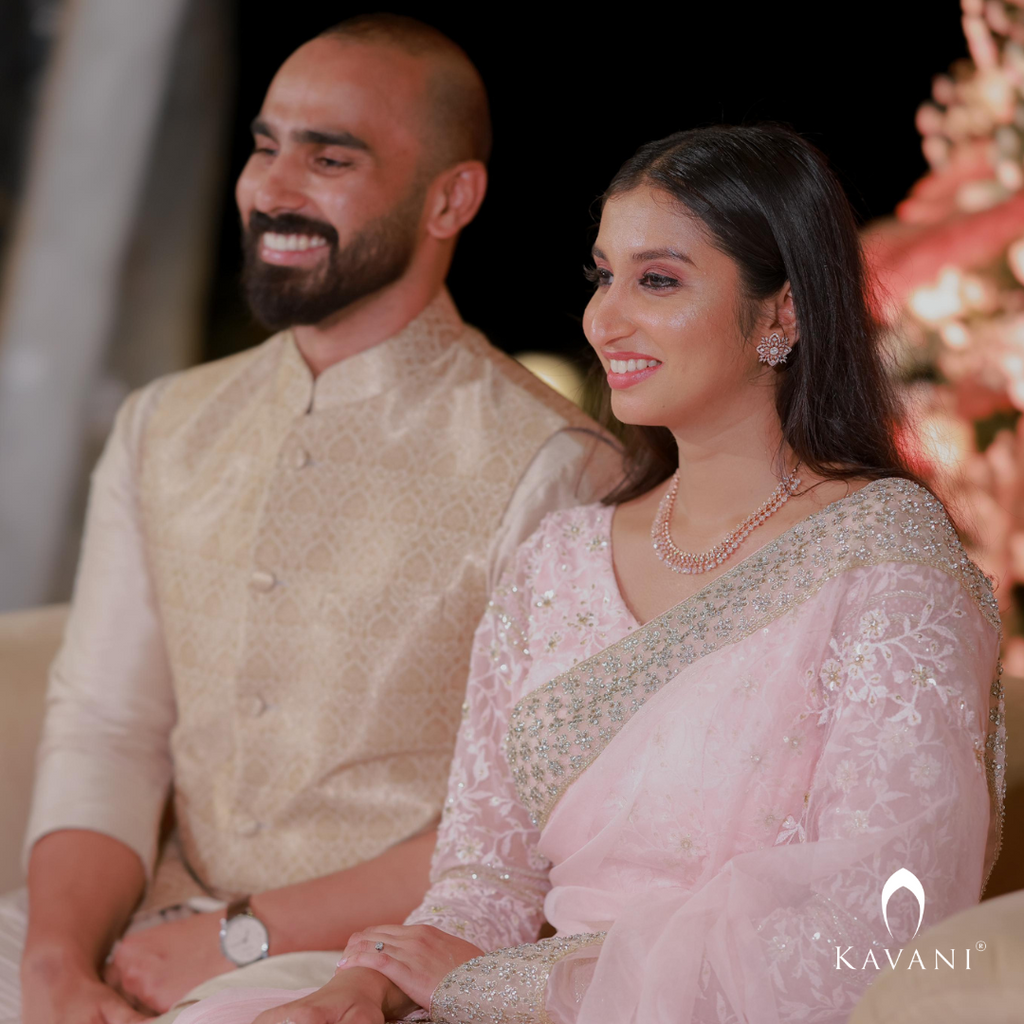 Our bride in her stunning look with a bridal saree in a pinkish shade with enhancing lace embroidery with embellishment done with hand embroidery