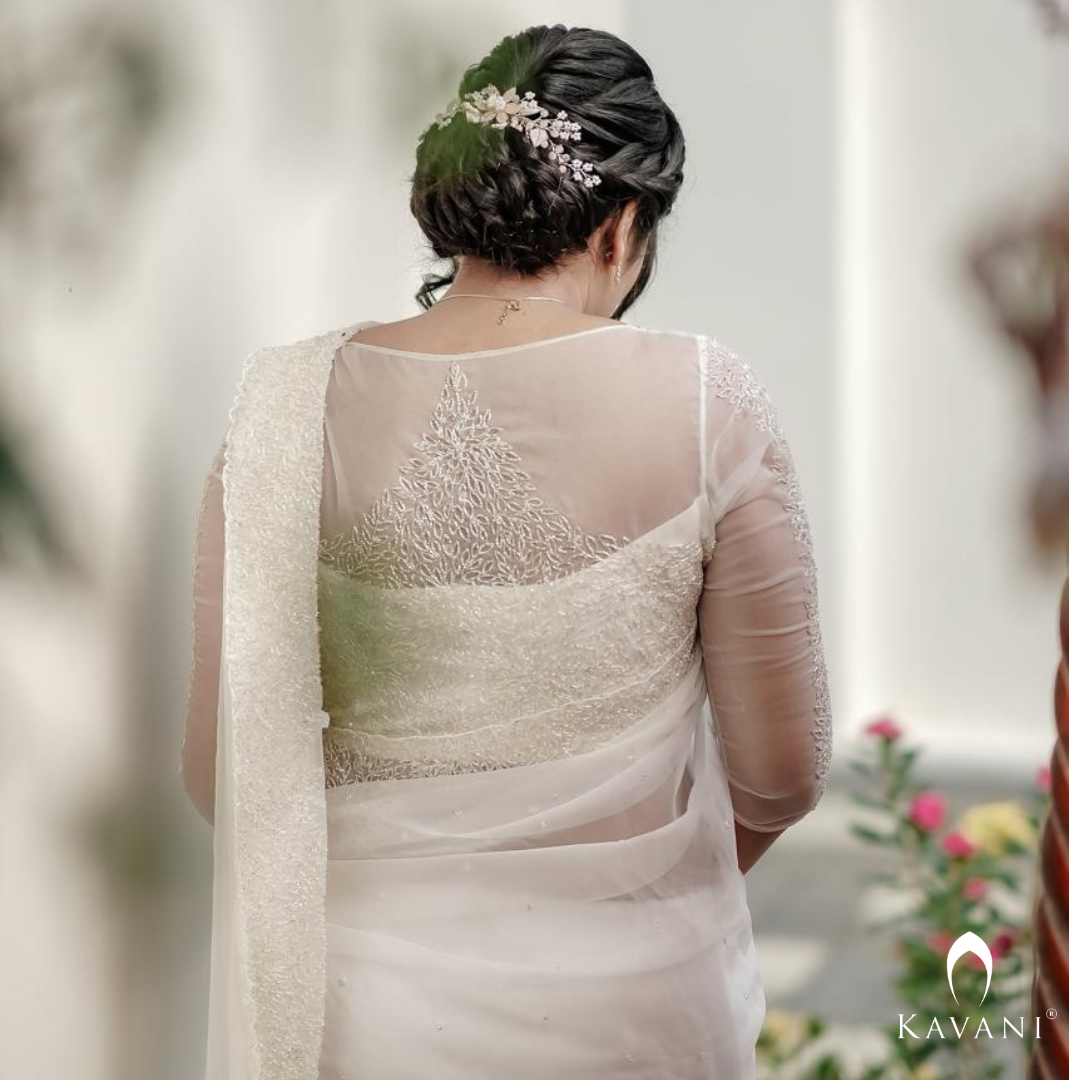 Our beautiful bride in her off white saree with beautiful hand embroidery