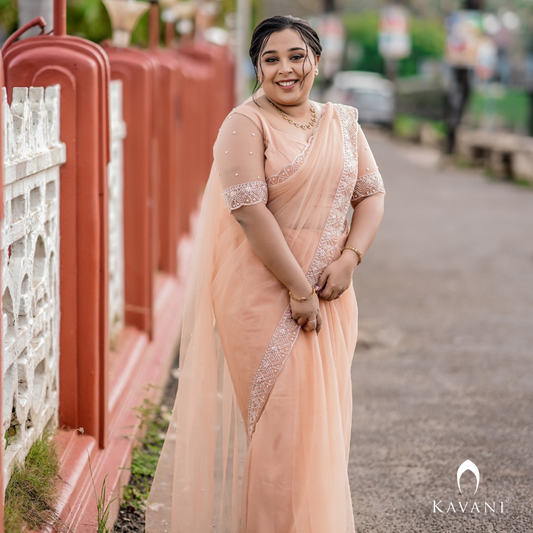 Our beautiful bride in her stunning hand embroidered pastel peach shade saree