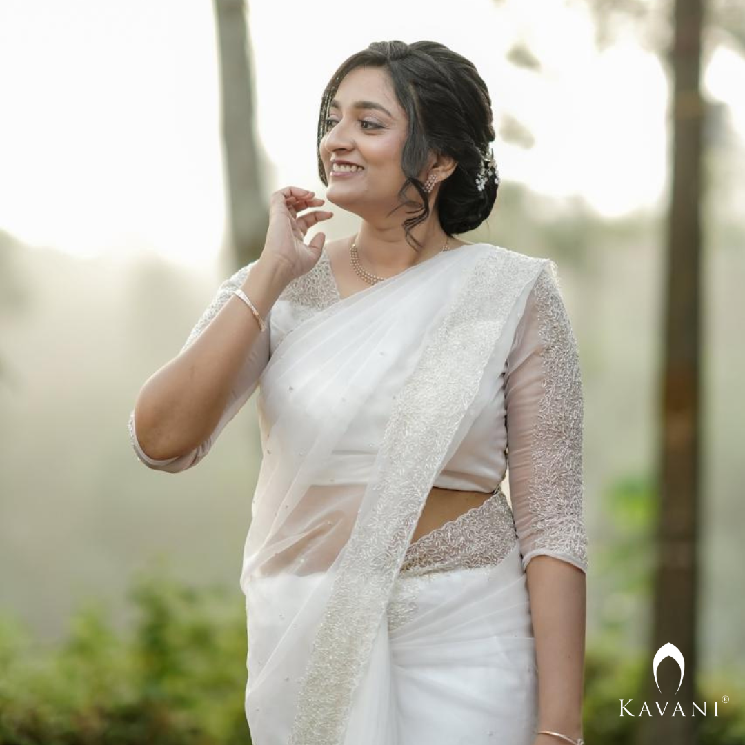 Our beautiful bride in her off white saree with beautiful hand embroidery