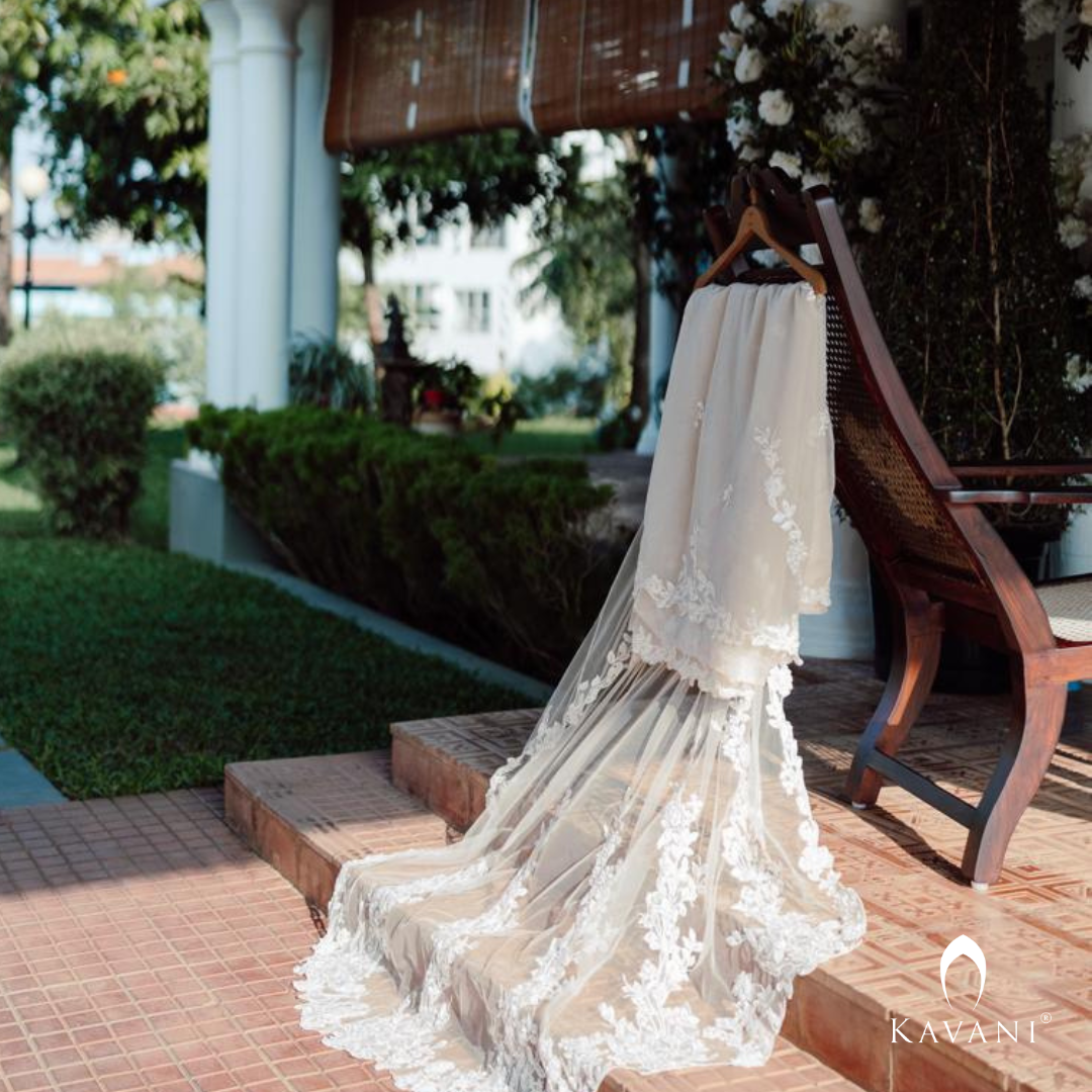 Our beautiful bride in her bridal pastel saree with lace embroidery with long trailing