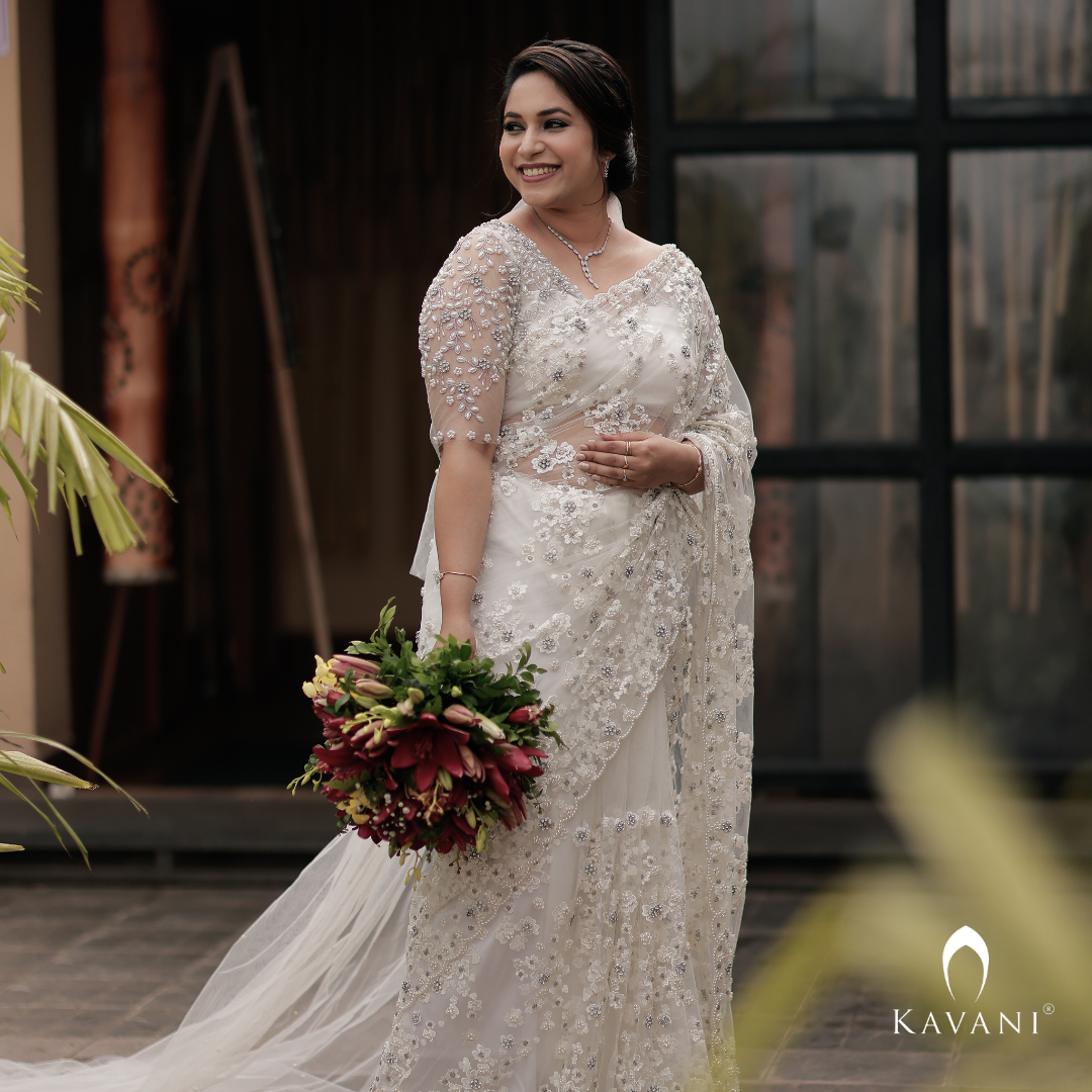 Our pretty bride in her stunning bridal saree with fully hand embroidered