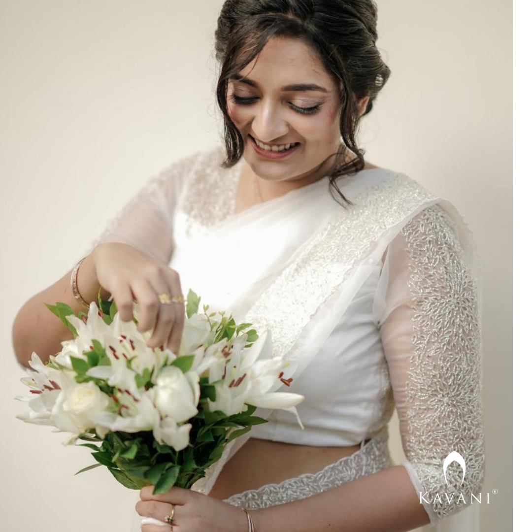 Our beautiful bride in her off white saree with beautiful hand embroidery