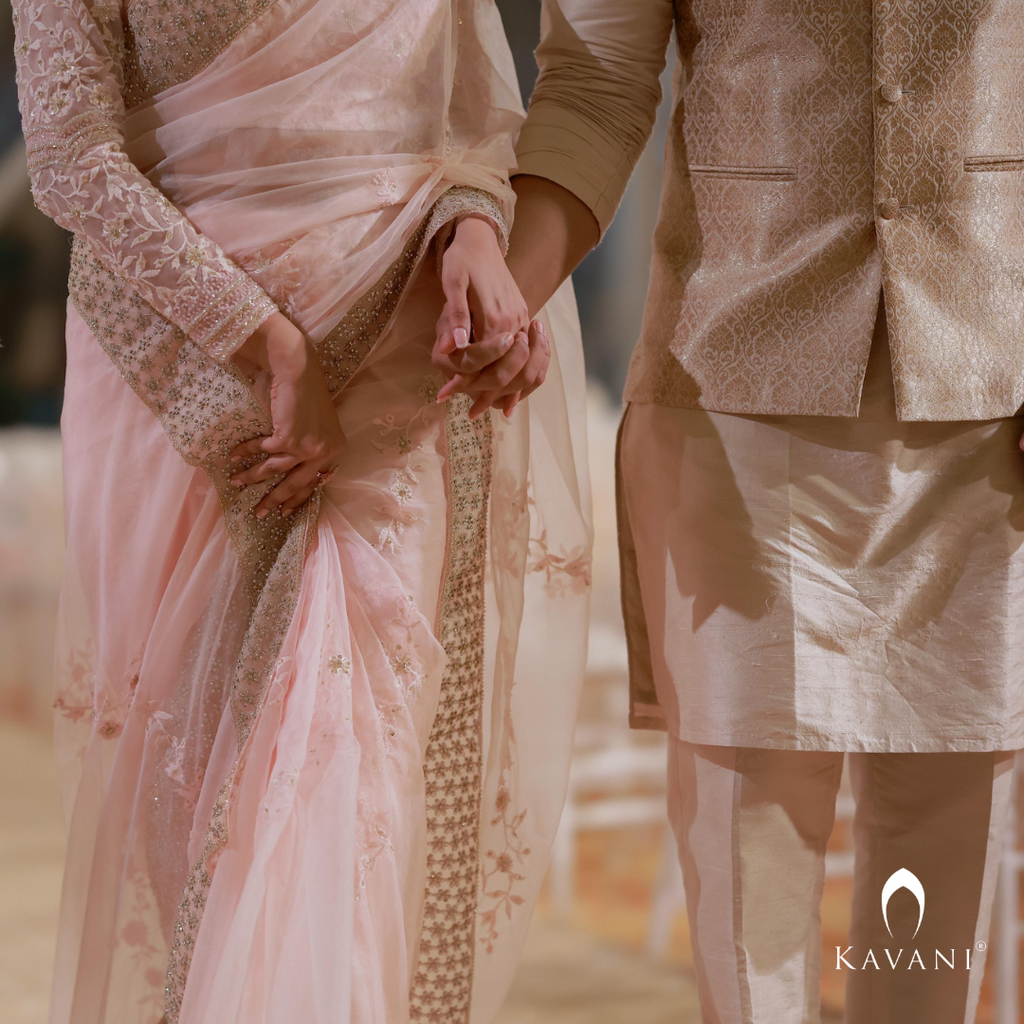 Our bride in her stunning look with a bridal saree in a pinkish shade with enhancing lace embroidery with embellishment done with hand embroidery