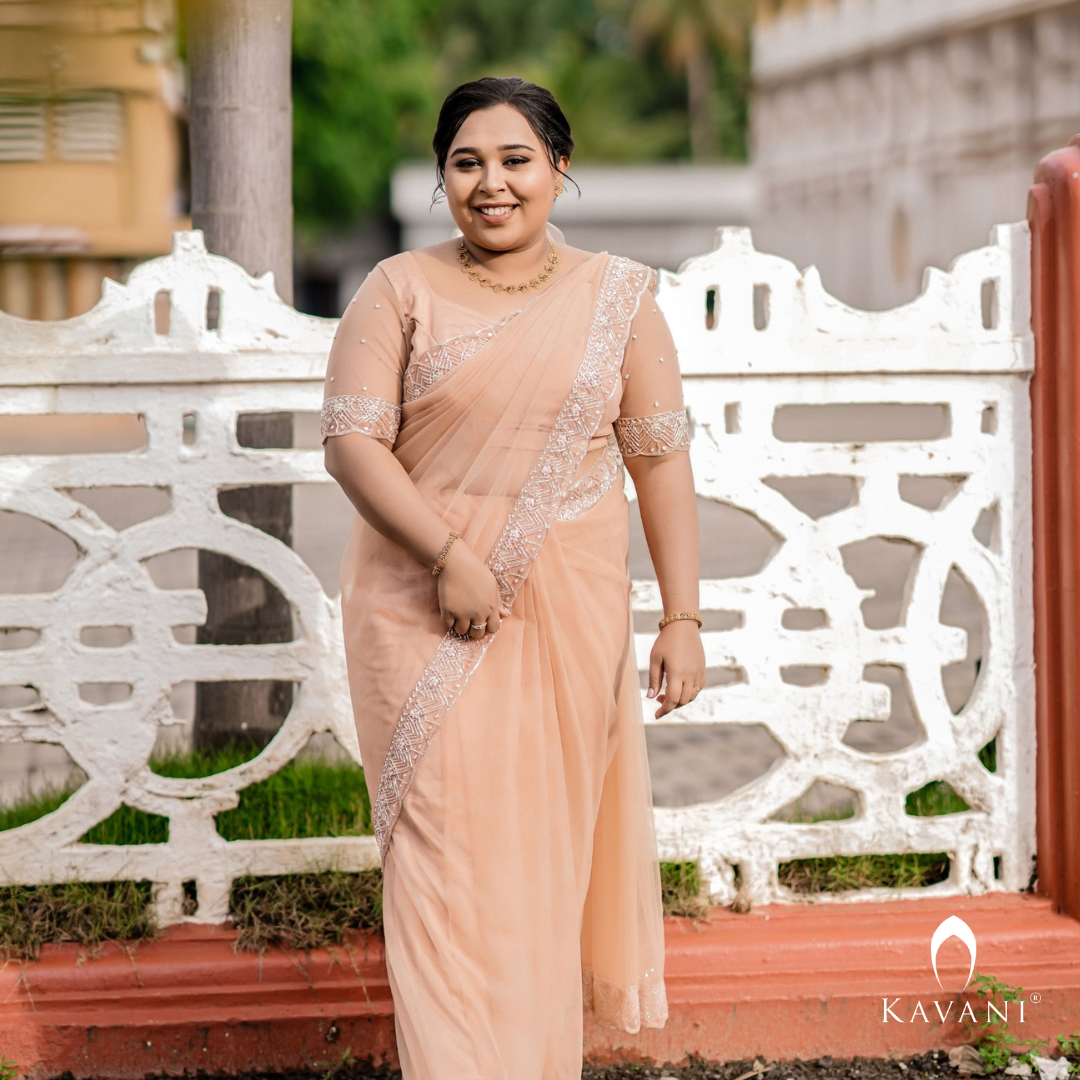 Our beautiful bride in her stunning hand embroidered pastel peach shade saree