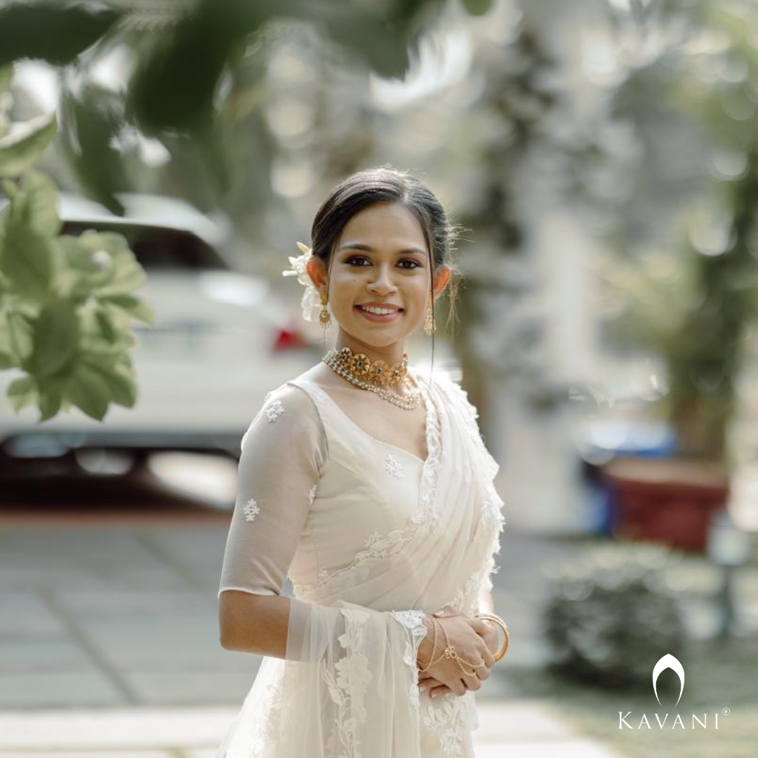 Our beautiful bride in her bridal pastel saree with lace embroidery with long trailing