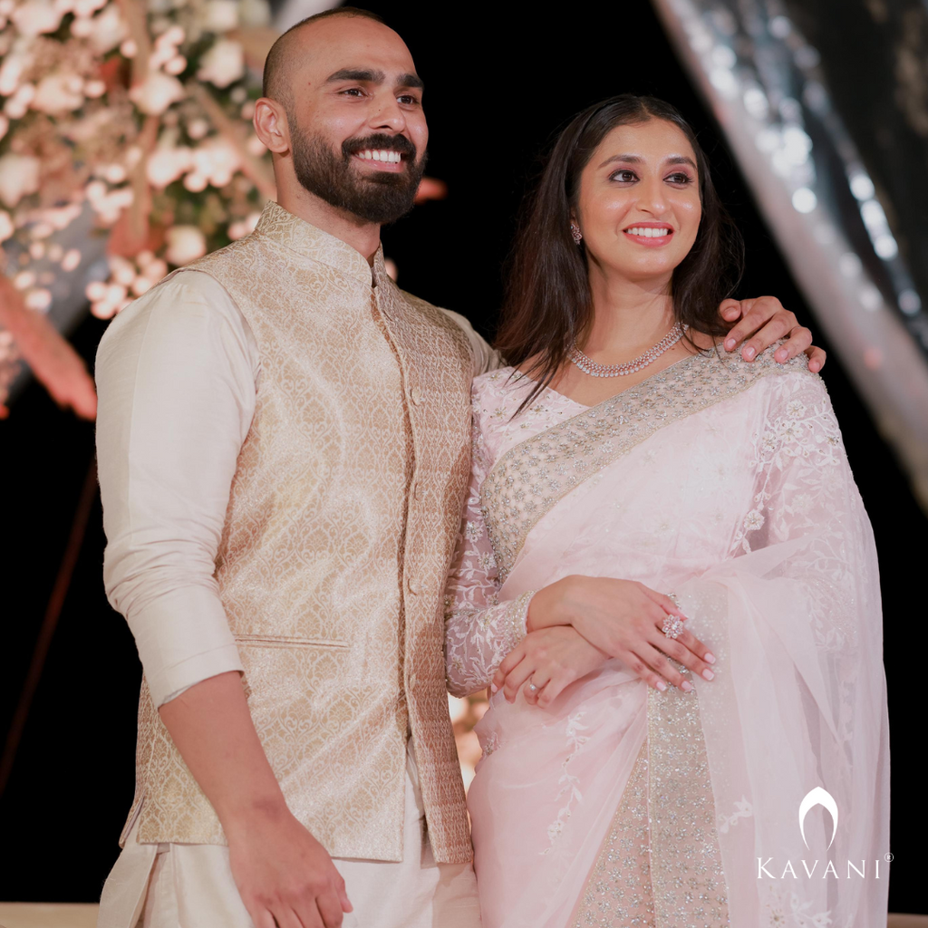 Our bride in her stunning look with a bridal saree in a pinkish shade with enhancing lace embroidery with embellishment done with hand embroidery