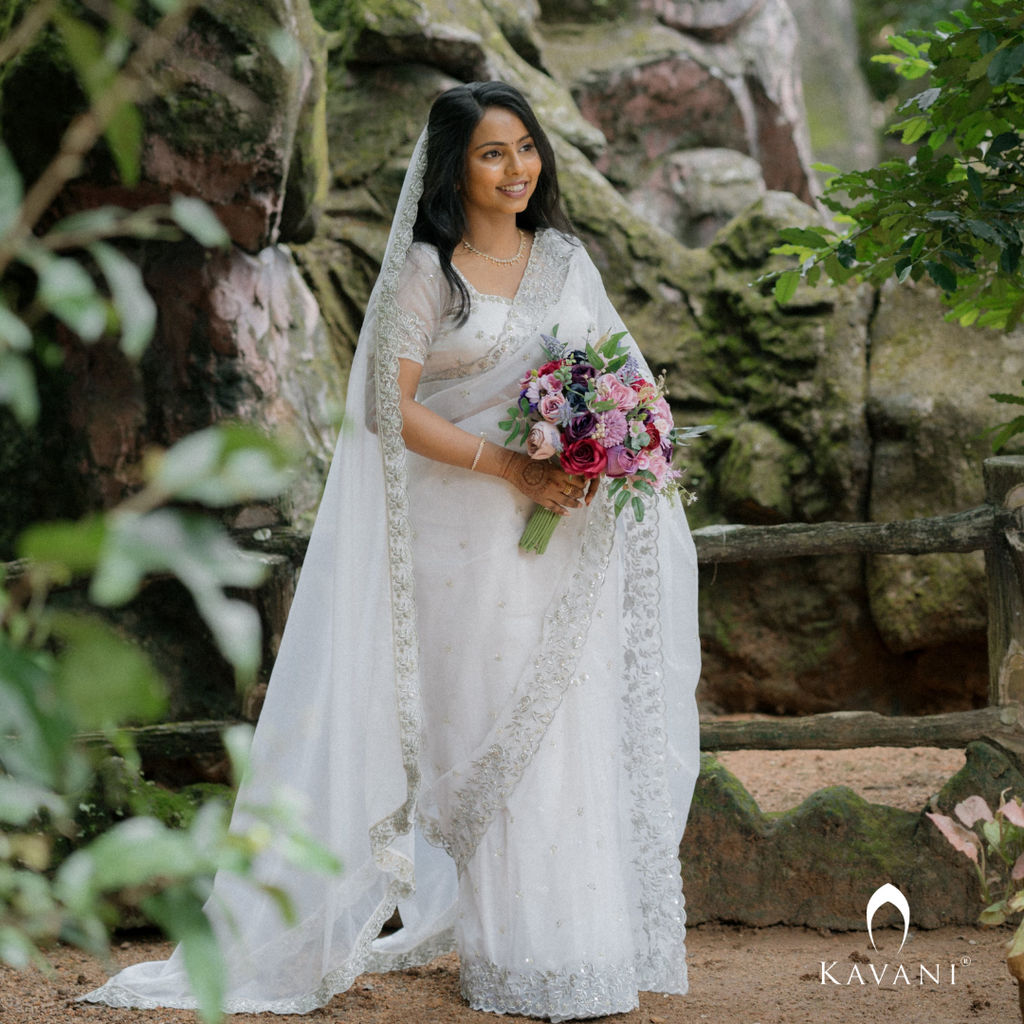 Our bride in her beautiful and stunning looking outlook wearing her bridal organza saree with machine embroidery and hand embroidery