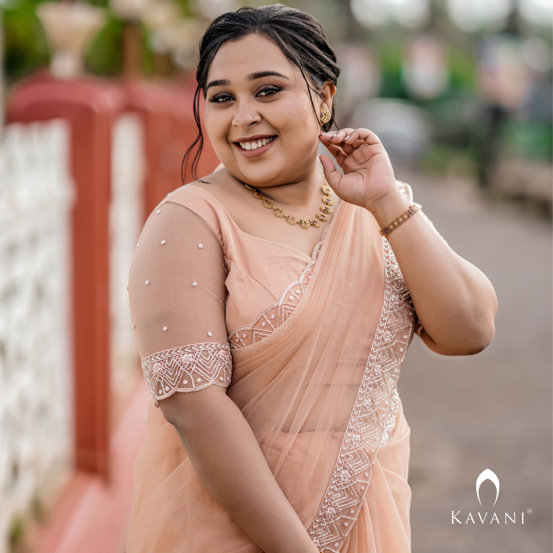 Our beautiful bride in her stunning hand embroidered pastel peach shade saree