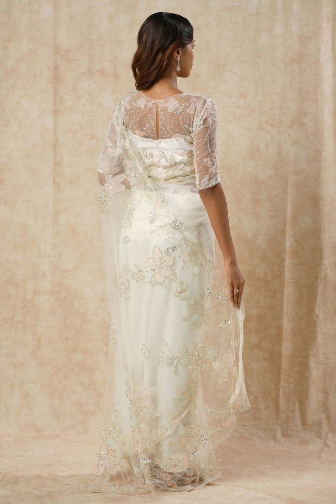 Off-White Saree with Floral Appliqué and Bead Outline Highlighting