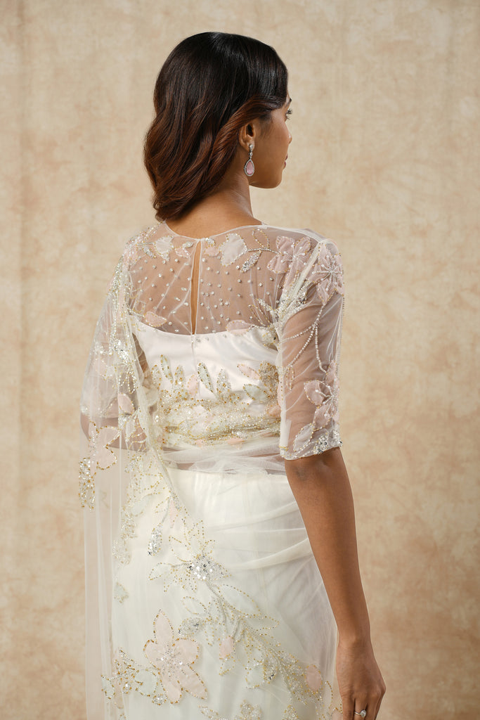 Off-White Saree with Floral Appliqué and Bead Outline Highlighting
