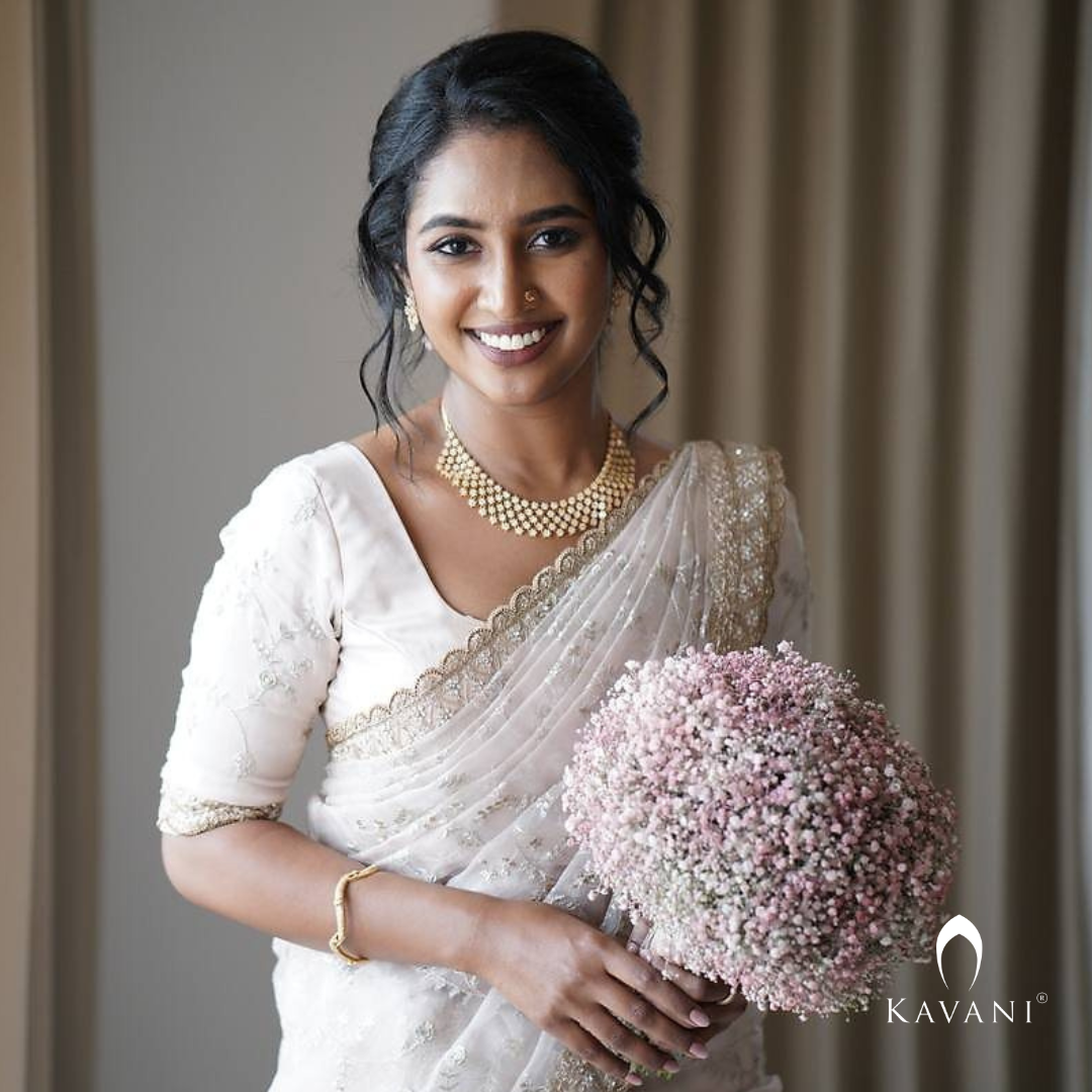 Our beautiful bride showing her elegance of her bridal outlook with beautiful bridal organza saree  with complete thread embroidery and enhancing hand embroidery work