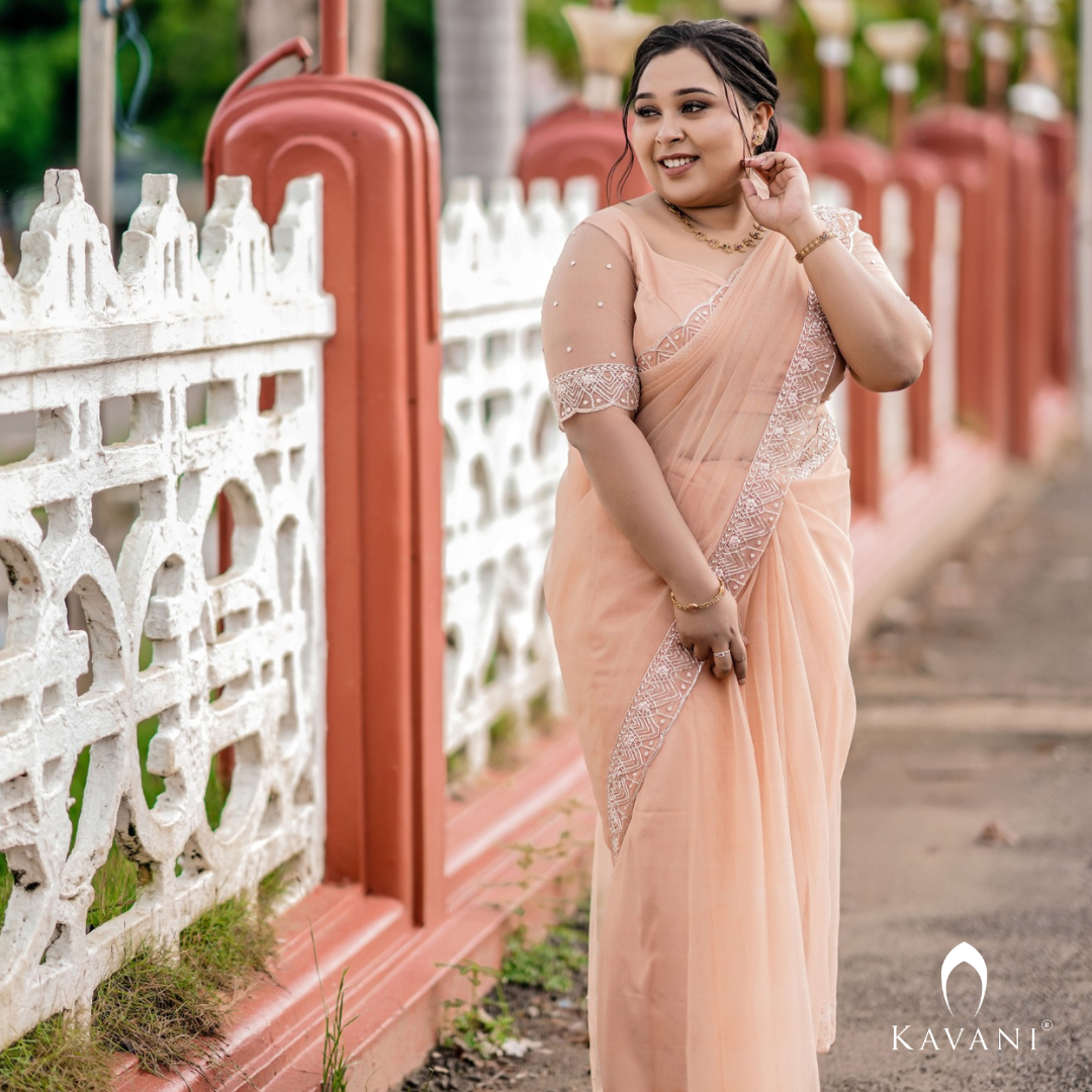 Our beautiful bride in her stunning hand embroidered pastel peach shade saree