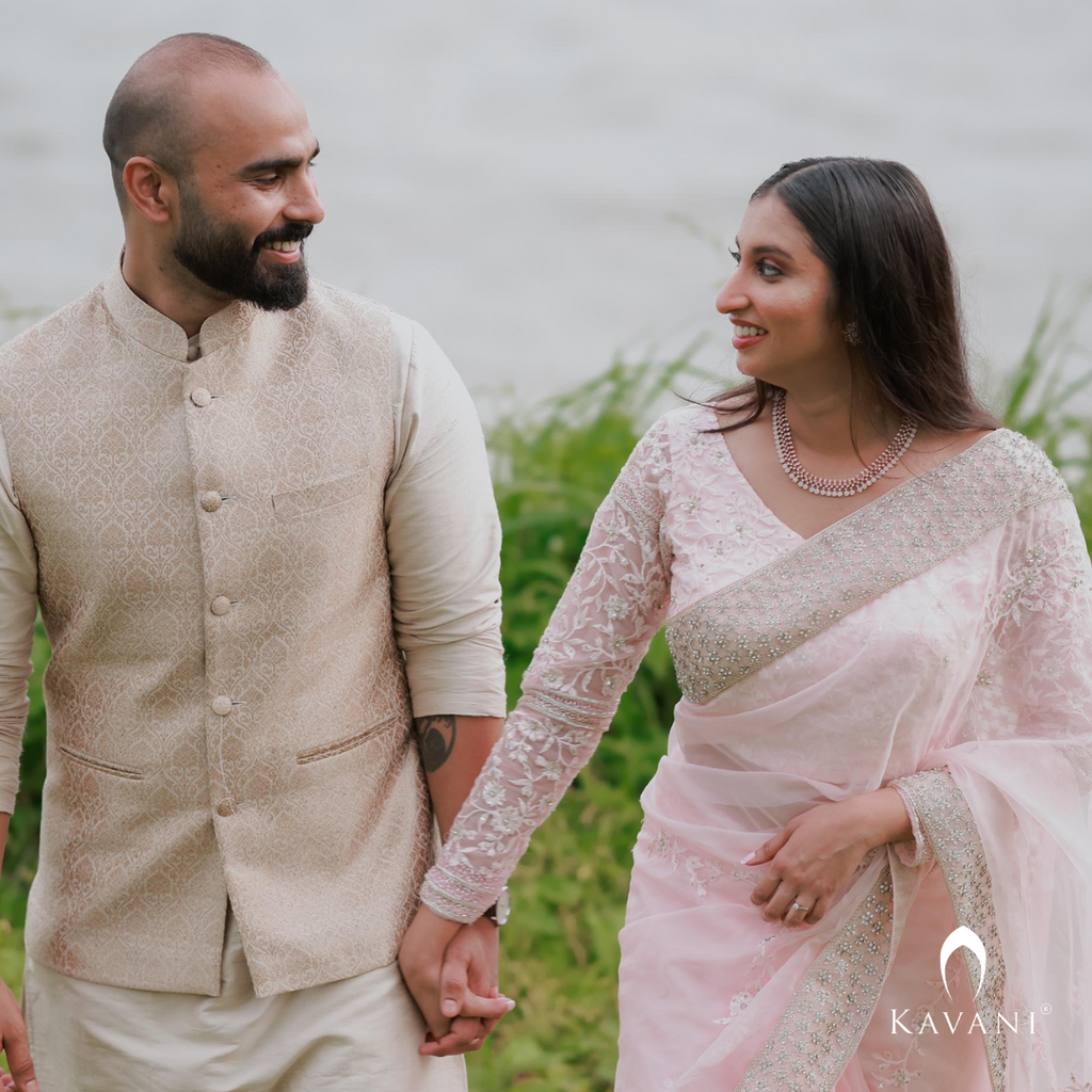 Our bride in her stunning look with a bridal saree in a pinkish shade with enhancing lace embroidery with embellishment done with hand embroidery