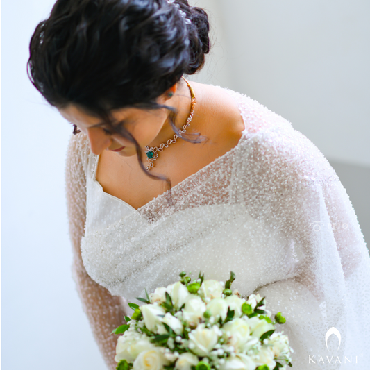 Our bride in her white bridal saree with sequence work with heavy hand embroidey