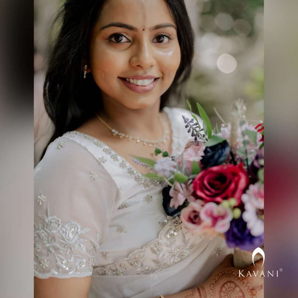 Our bride in her beautiful and stunning looking outlook wearing her bridal organza saree with machine embroidery and hand embroidery