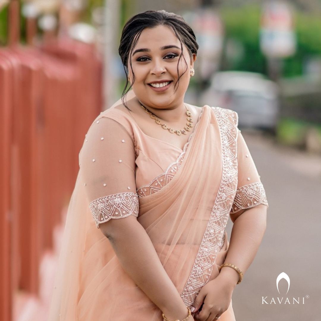 Our beautiful bride in her stunning hand embroidered pastel peach shade saree