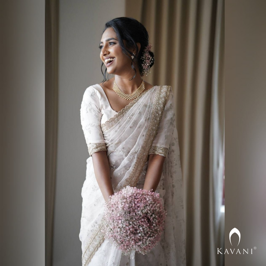 Our beautiful bride showing her elegance of her bridal outlook with beautiful bridal organza saree  with complete thread embroidery and enhancing hand embroidery work