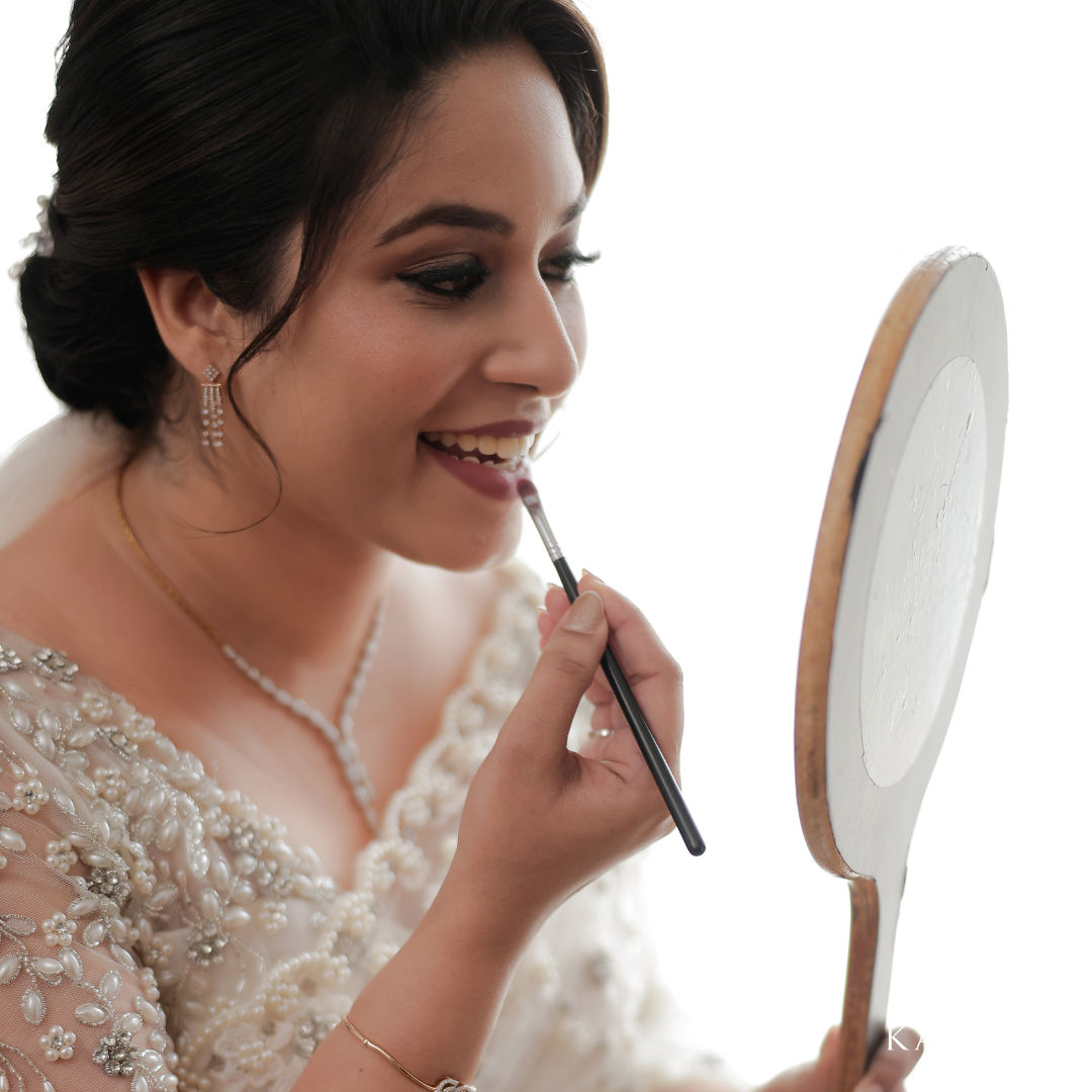 Our pretty bride in her stunning bridal saree with fully hand embroidered