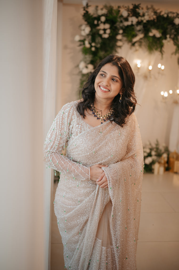 Gold Beaded Saree with Emerald Crystal Accents – Chandelier Collection