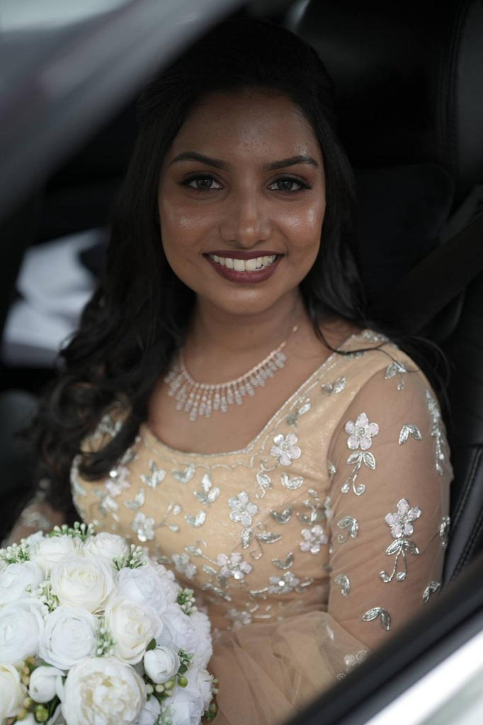Pastel Orange Intricately Beaded Lehenga Set with Matching Veil