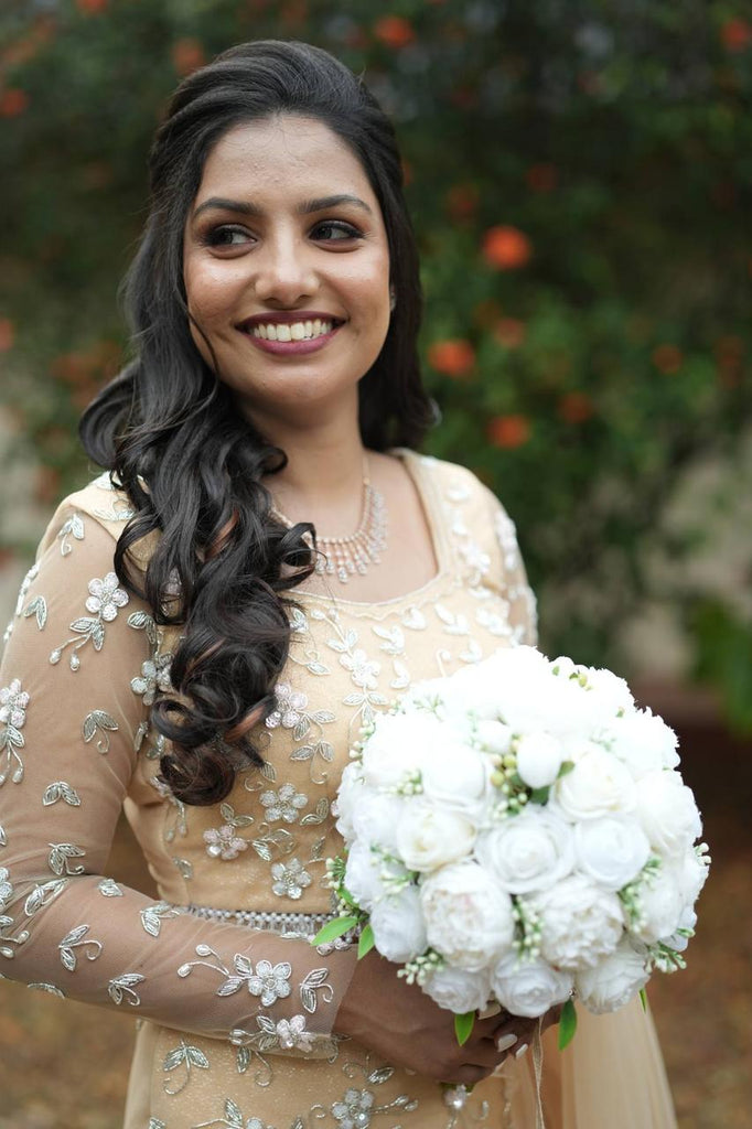 Pastel Orange Intricately Beaded Lehenga Set with Matching Veil