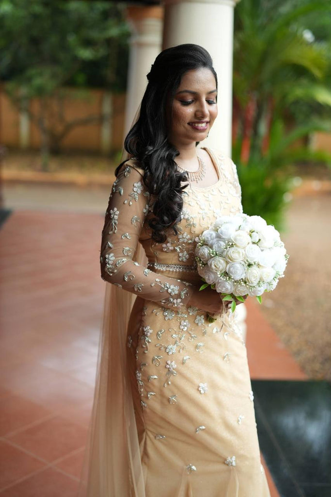 Pastel Orange Intricately Beaded Lehenga Set with Matching Veil