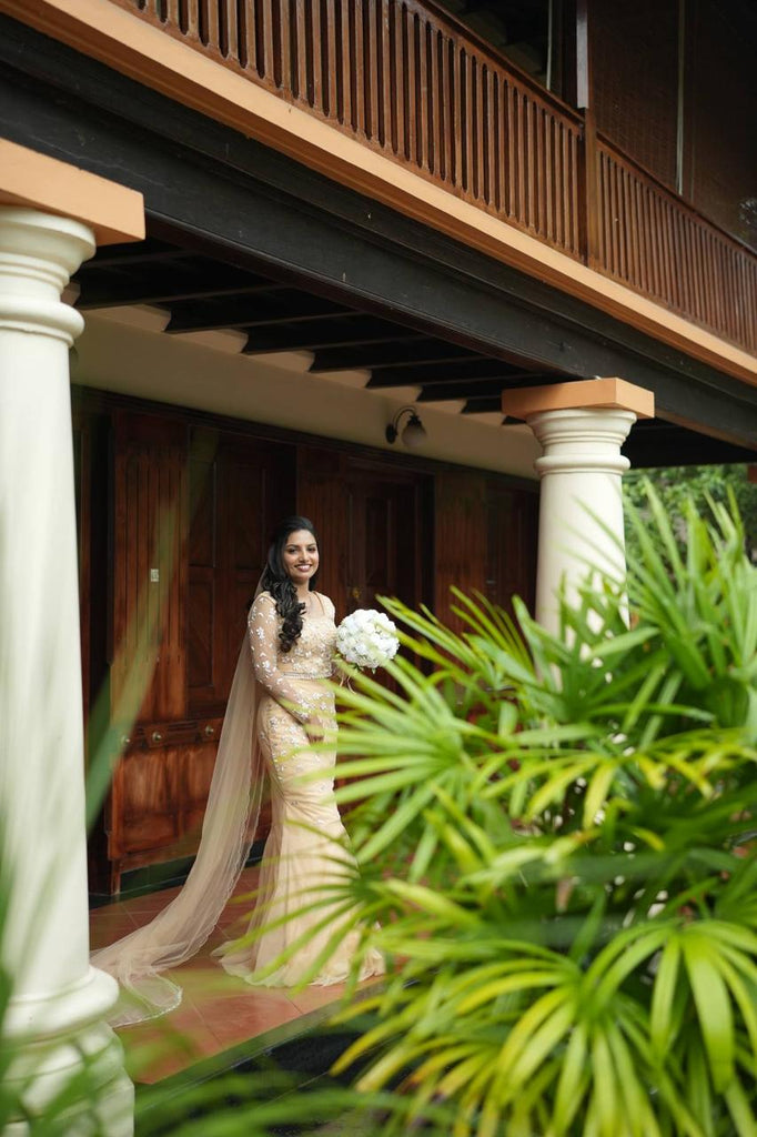 Pastel Orange Intricately Beaded Lehenga Set with Matching Veil