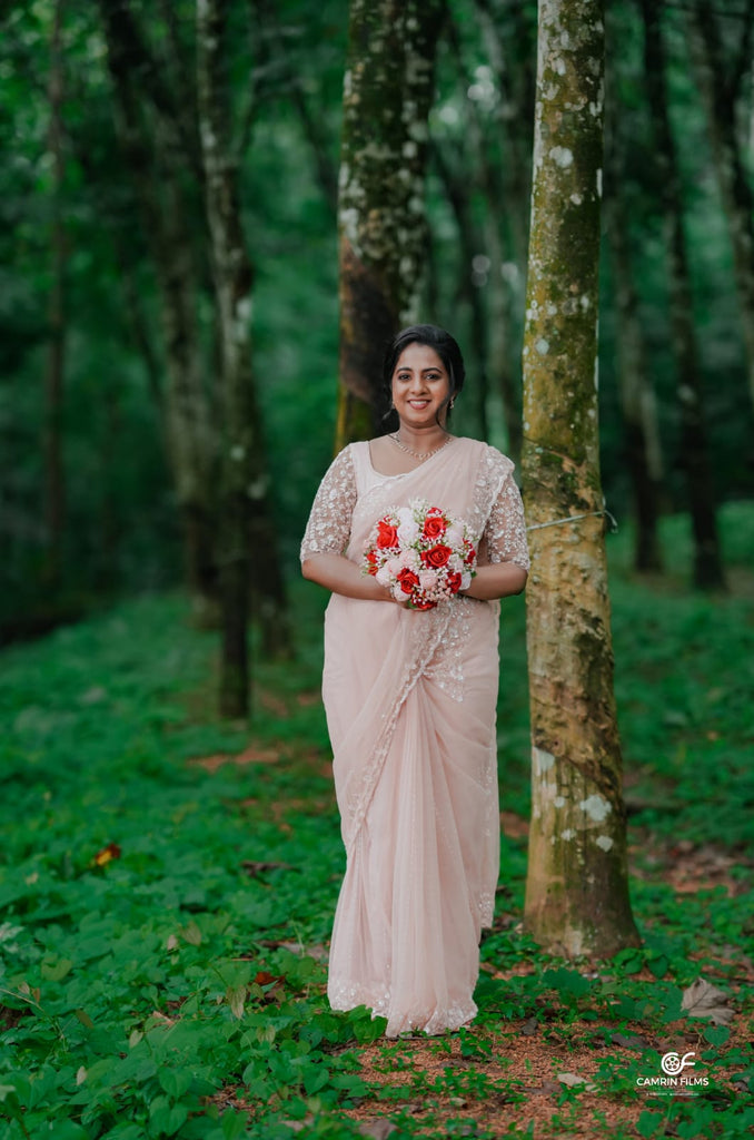 Peach Beaded Wedding Saree with Delicate Sleeve & Border Embellishments