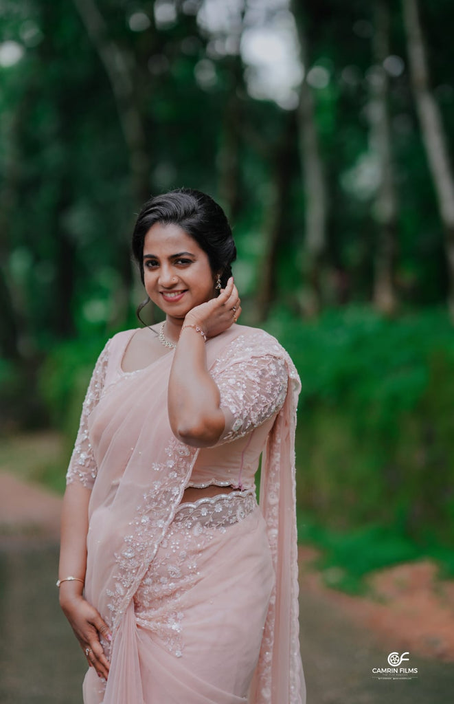 Peach Beaded Wedding Saree with Delicate Sleeve & Border Embellishments