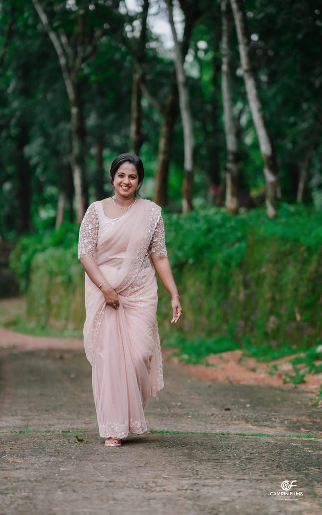 Peach Beaded Wedding Saree with Delicate Sleeve & Border Embellishments