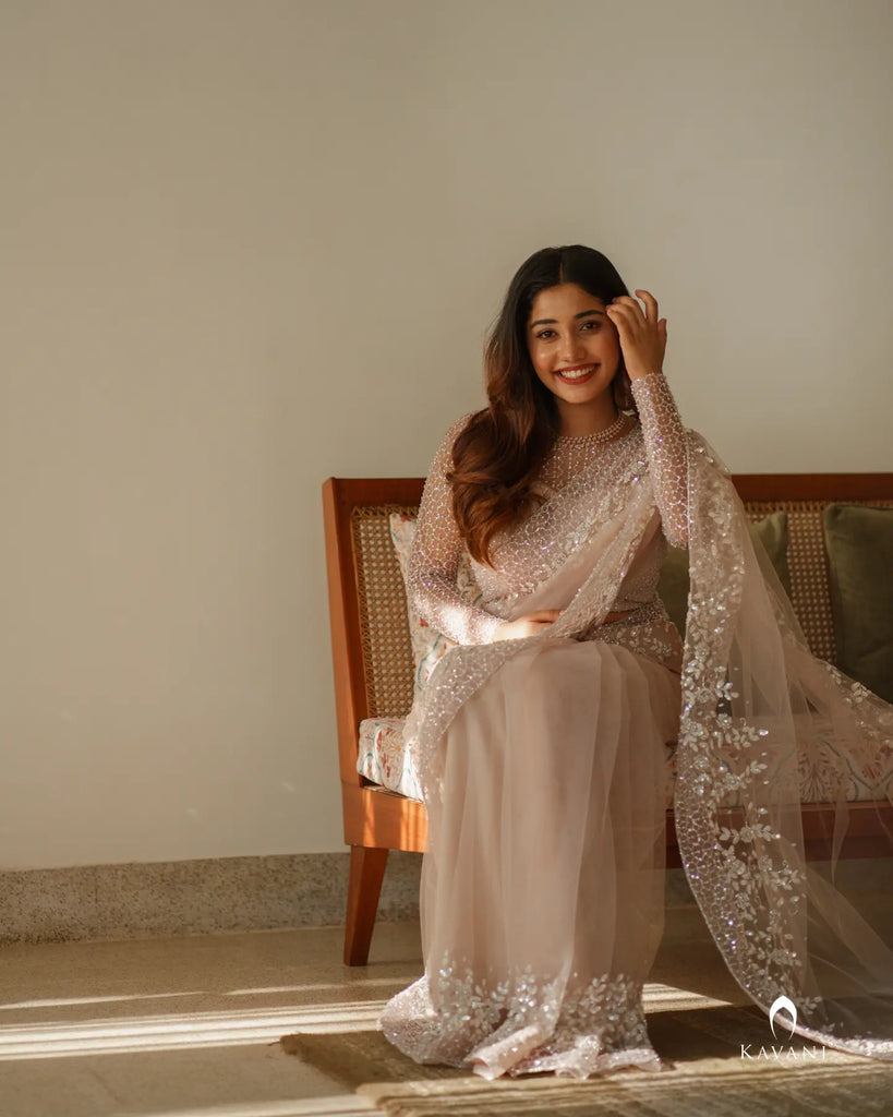 Wedding saree in a dusty nude pink shade with beautiful handwork