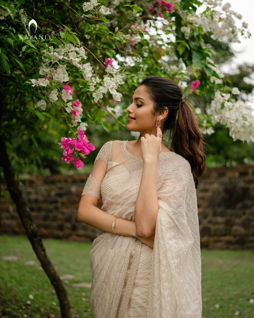 Our signature bridal saree in a light gold shade with beautiful lines of hand embroidery