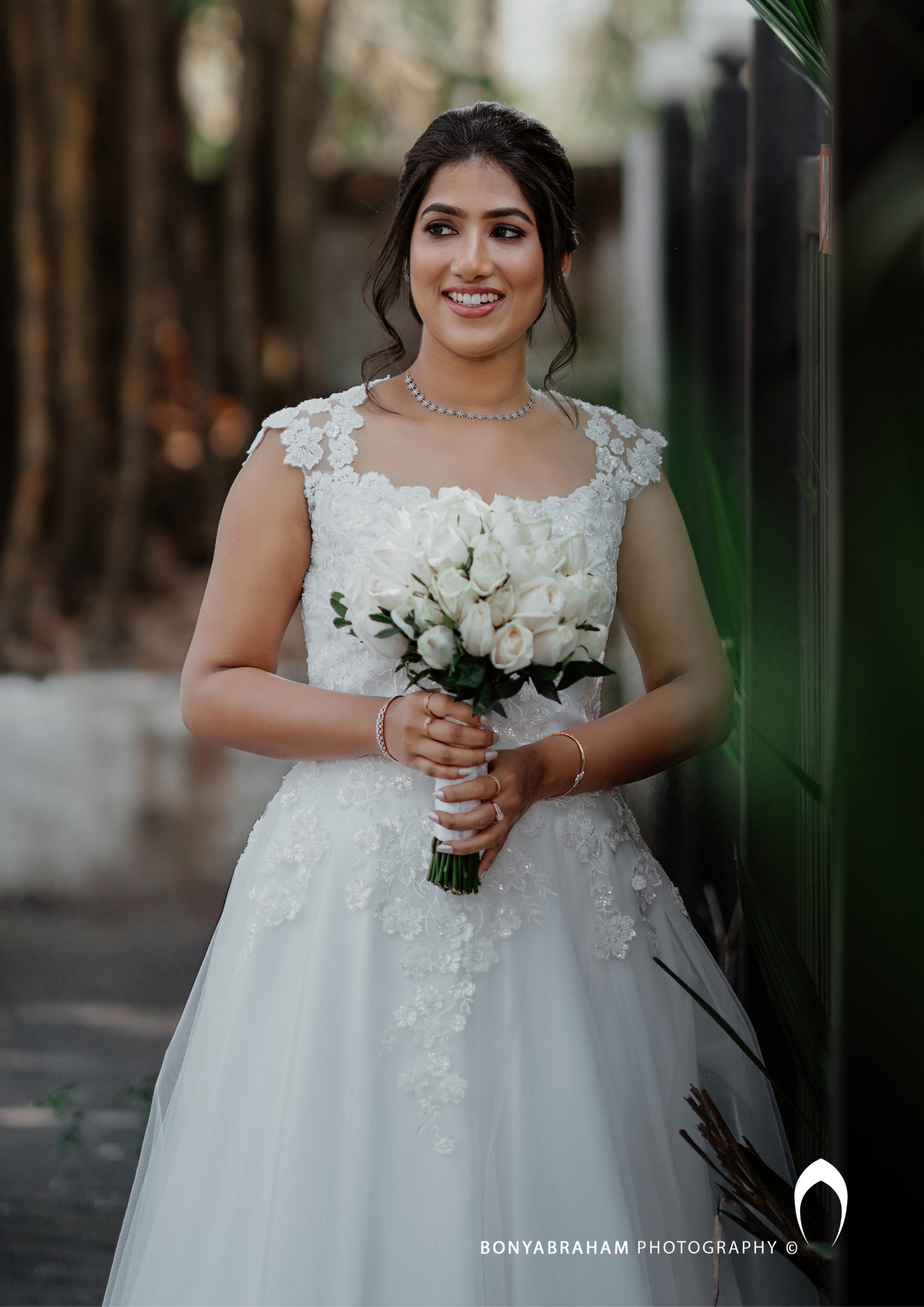 Signature Christian bridal  A-line  gown in net carried by bride Elizabeth