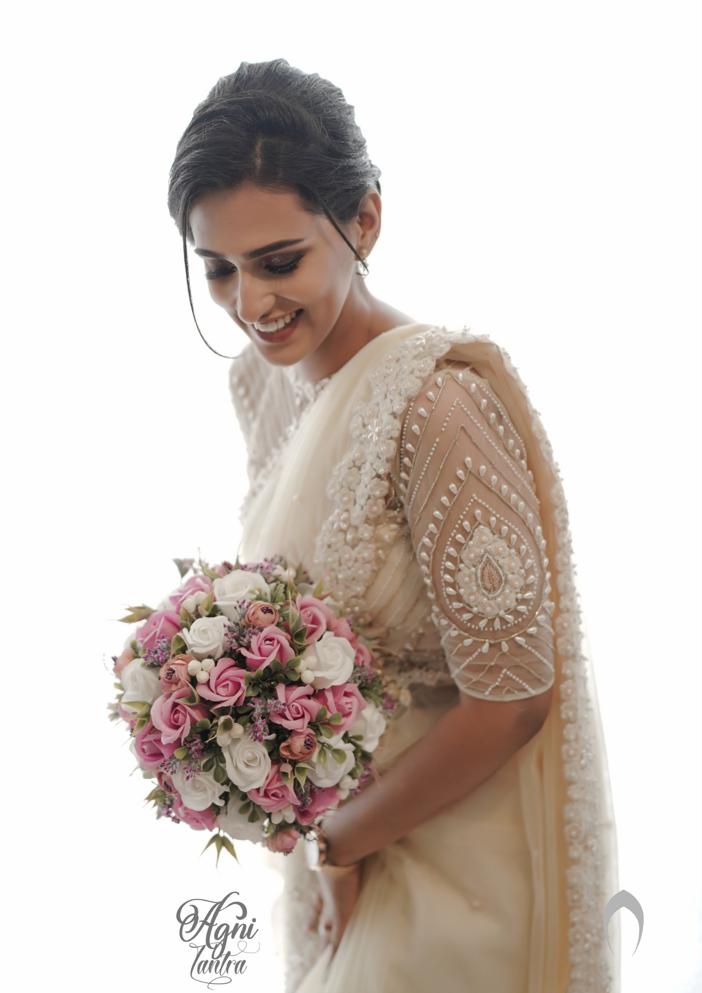 signature Christian bridal cream saree in net with floral lace work