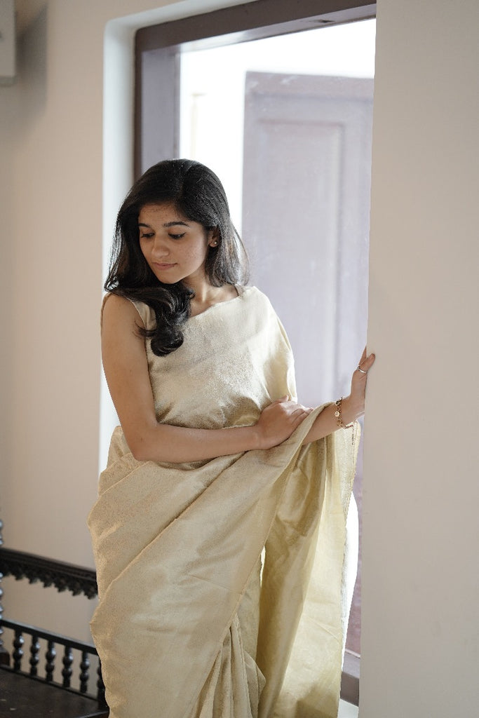 Signature bridal banarasi saree in cream tone with jeri work